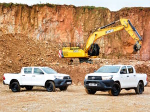 Toyota Hilux pickups with JCB digger