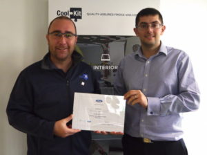 CoolKit staff members with Ford QVM certificate